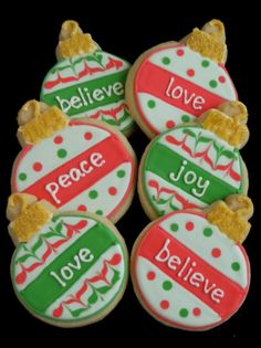 decorated cookies with the words peace, love, and joy