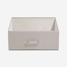 a white box with two gold handles on the top and bottom, sitting against a white background