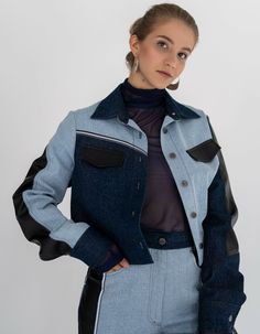 A straight-cut jacket made of denim in light and dark shades, as well as black vegan leather, reaching the waist. It features a shirt collar, button closure, and long sleeves. The jacket is additionally adorned with reflective tape, giving it a stylish and modern look and making you visible in the dark.Product Specifications:Back length: 43 cm / 17 insleeve length: 66 cm / 26 inSeason: Spring/Summer/FallModel height: 170 cm / 67 in, wearing size One sizeComposition: 100% cottonCare: Delicate wash at 30°C. Spin at 600-800 rpm. Do not use the tumble dryer.Avoid chlorine bleach and stain removers. Ironing: medium temperature, STRICTLY from the inside out.About the brand:7/11 Seven Eleven has been working since July 2015. The brand creates qualitative unisex, obscenely feminine, ultrasexual fa Urban Fitted Denim Jacket For Workwear, Trendy Blue Cropped Jacket For Work, Winter Workwear Blue Denim Jacket, Modern Denim Outerwear For Fall, Blue Denim Jacket Outfit, Seven Eleven, Stain Removers, Denim Jacket Outfit, Reflective Tape