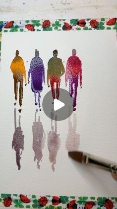 someone is painting people on paper with watercolors in the shape of their body