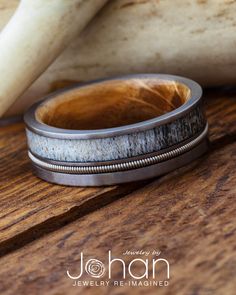 a wooden and metal ring sitting on top of a table