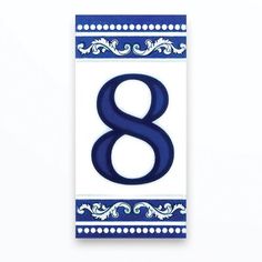 a blue and white sign with the number eight in it's center on a white background