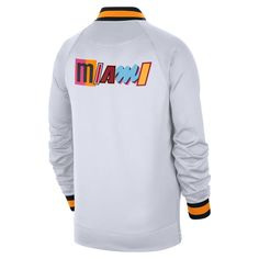 Show the Miami Heat that you're a die-hard fan by grabbing this 2022/23 City Edition Showtime Thermaflex Full-Zip Jacket from Nike. The crisp graphics and the special City Edition design make this unlike anything else in your Miami Heat collection. No one will doubt your fandom when they see you in this unique Miami Heat gear. Officially licensed Imported Material: 93% Polyester/7% Spandex Full Zip Long sleeve Zippered vents along the sides Stretch-ribbed cuffs Brand: Nike Printed graphics Full- Sports Season Fan Gear Track Jacket, Fan Gear Track Jacket For Sports Season, Throwback Long Sleeve Track Jacket For Sports Events, Nike Track Jacket For Sports Events, Nike Sportswear Track Jacket For Sports Events, Nike White Track Jacket For Sports Events, Nba Store, Miami Heat, Nike White