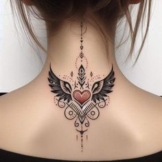 a woman with a heart and wings tattoo on her neck