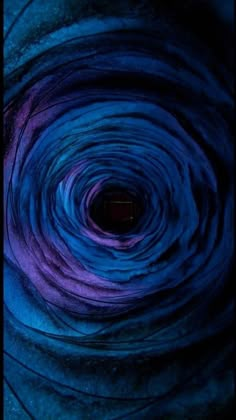 a blue and purple swirl is shown in this image