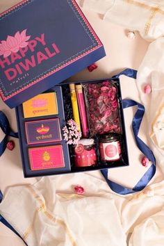 the happy diwali box is packed with candles and other things to put in it