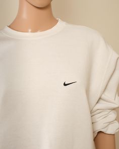 90s Vintage Nike Sweatshirt This is a perfect Nike streetwear piece from the mid-1990s. white sweatshirt with the iconic black swoosh, understated and classic. Grab this today before it's gone!  One small discoloration imperfection -- see photo  Tag Large Measurements Neck 8 inches waist 22 inches armpit 8 inches Arm length 22 inches wrist to wrist across back 63 inches top to bottom 24 Sweatshirts Nike, Nike Streetwear, Vintage Nike Sweatshirt, Photo Tag, Nike Sweatshirt, Nike Vintage, Nike Sweatshirts, Vintage Sweatshirt, White Sweatshirt