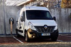 a white van parked next to a parking meter