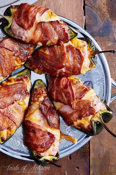 bacon wrapped jalapeno peppers on a plate