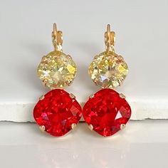 Sparkly, eye-catching, Luminous Yellow and Siam Red crystal earrings will brighten up any outfit! The precision-cut crystals and unmatched, gorgeous colors are always show-stoppers! Details: * Square Cushion Crystals- 1/2"( 13mm), 3/8"(10mm) * 14k Gold-plated lever back Earrings  * Earring Length- 1 1/4"(30mm) * Lead and Nickel-free These earrings come in a jewelry bag and box with ribbon. Red Crystal Earrings For Gift, Red Crystal Round Earrings, Earrings Square, Earrings Colorful, Leverback Earrings, Crystal Drop Earrings, Red Crystals, Crystal Drop, Rhinestone Earrings