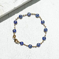 Nazar glass beads have been used to ward off the Evil Eye since approxiametly 1500 BCE. The Evil Eye is believed to be the malicious and jealous gaze of those who wish to do us harm. The Nazar eye beads are thought to protect you by bouncing that negative energy back to that person. . Our Nazar Bracelet is crafted of vintage glass Nazar beads set in 14k gold-plate over brass. Approx. 7.25" Nazar Bracelet Aesthetic, Nazar Jewelry, Nazar Bracelet, The Evil Eye, Treasure Hunter, You Are My Favorite, Eye Beads, Pretty Clothes, Birthday Wishlist