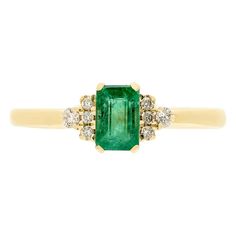 10K yellow gold ring with one 6x4 millimeter emerald cut emerald and 8 round brilliant cut diamond accents Green Emerald-cut Cluster Ring With Diamond Accents, Emerald Cut Green Cluster Ring With Diamond Accents, Emerald Band Ring, Sapphire Side Stones, Emerald Jewellery, Emerald Rings, Emerald Ring Gold, Helzberg Diamonds, Emerald Diamond Ring