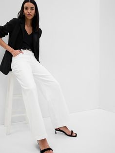 Fit: Fitted in the waist & hips with an ankle-length, relaxed wide leg.  Fabric: 99% Cotton, 1% Stretch.  Stretch: Low Stretch Jeans.  Our most comfortable authentic denim.  Holds you in at the hips & waist but feels easy everywhere else.  Rise: High Rise Jeans.  Look: A classic five-pocket jean in a white wash.  Details: Zip fly & five-pocket styling.  Responsibly Made: This pair of jeans is part of our water-saving Washwell program.  Compared to conventional wash methods, Washwell has saved mi Gap Chic Bottoms With Relaxed Fit, Chic Gap Bottoms With Relaxed Fit, Gap Relaxed Fit Wide Leg Jeans, Gap Relaxed Fit Jeans For Workwear, Gap High Waist Jeans For Fall, Gap Wide Leg Flare Jeans, Gap Wide Leg Pants For Spring, Gap Cotton Flare Jeans For Spring, Chic Straight Leg Gap Jeans