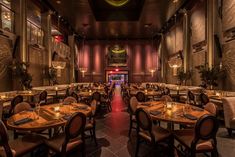 an empty restaurant with many tables and chairs