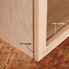 the bottom half of a wooden cabinet with measurements