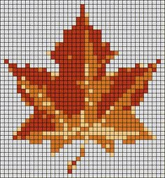 a cross stitch pattern with an orange maple leaf