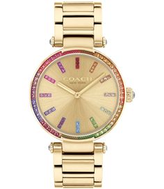 From COACH&#x2C; this women's watch features: Gold-tone stainless steel case and braceletGold dial with bright rainbow-hued pav crystals on the bezel and markersDeployment closureMineral crystalQuartz analog movementCase diameter approx. 34mmWater-resistant to 99 feetImported. Multicolor Watches With Diamond Hour Markers And Round Dial, Multicolor Watch With Diamond Hour Markers, Multicolor Watches With Diamond Hour Markers, Coach Jewelry With Diamond Hour Markers, Dope Jewelry Accessories, Coach Watch, Movado Watch, Rhinestone Watches, Bright Rainbow