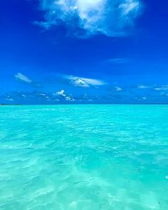 the water is very clear and blue with some clouds