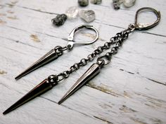 One gunmetal spike earring, Spike dangle, Black matte spike, Punk earring, Gothic earring, Black spike dangle, Steampunk earring, Goth earring. Smallest one length 1.5 Inches ( 37 mm ) Biggest one with chain length 3 Inches ( 75 mm ) NOTE: Delivery time to Europe is 7 to 14 working days. Delivery time to US or the rest of the world - 14-30 working days. Edgy Metal Plug Earrings, Black Metal Grunge Earrings, Edgy Gunmetal Jewelry, Edgy Dangle Plug Earrings, Edgy Nickel-free Dangle Plug Earrings, Edgy Metal Drop Plug Earrings, Edgy Metal Earrings With Ear Wire, Punk Metal Earrings With Spikes, Punk Metal Spiked Earrings