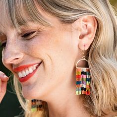 Check it out! Our new hand-beaded earrings are taking the internet by storm. With their flowy fringe and trendy checkered pattern, these lightweight statement earrings will soon become your jewelry box go-tos. Style tip: We're waving the checkered flag because these multicolored earrings are WINNERS. Don't forget to complete the look with its check mate, the Olive stretch bracelet! --DETAILS-- 3.5" L x 1" W Handmade by skilled artisans in India Hypoallergenic nickel + lead-free brass hardware Th Ombre Fringe Earrings, Block Print Scarf, Muted Rainbow, Bead Collection, Mint Coral, Striped Earrings, Beaded Fringe Earrings, Alloy Earrings, Green Ombre