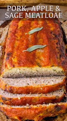 a loaf of meat sitting on top of a wooden cutting board