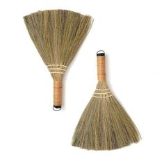 two brooms that are sitting next to each other