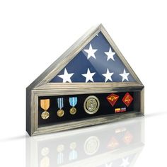 This Military Shadow Box Display Case is the perfect way to honor and remember the service of American veterans. Made of solid wood and glass, it is built to last and stand the test of time. The case is large enough to hold a folded 5x9.5' flag, medals, and patches, so you can create a truly meaningful and personalized tribute. The case is designed to be both free-standing and wall-mounted, giving you the flexibility to display it in any room of your home. Whether you choose to place it on an en Military Shadow Box, Flag Display Case, Shadow Box Display Case, Flag Display, Medal Display, Box Display, American Veterans, Shadow Boxes, Frame Display