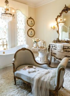 an ornately decorated bathroom is shown in this image, with antique furniture and mirrors on the walls