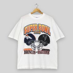 Vintage 1990s Super Bowl XXXIII Nfl T Shirt Large Atlanta Falcons Vs Denver Broncos Crewneck Shirt Super Bowl Nfl Football White Tees Size L Vintage T-shirt For Sports Season Fan Gear, Vintage Graphic Print T-shirt For Football Season, Vintage Halloween Fan Merchandise T-shirt, Vintage Nfl Shirts, Vintage Nfl Sweatshirt, Super Bowl Nfl, Nfl T Shirts, Denver Broncos, Atlanta Falcons