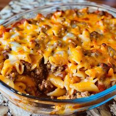 a casserole dish with cheese and ground beef