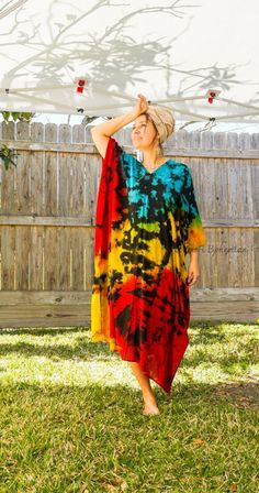 "Add a touch of unique style to your wardrobe with our Hand-Dyed Kaftan Dress! This stunning dress is made from 100% breathable and comfy rayon fabric, ensuring maximum comfort all day long. Using our unique method, each dress is carefully hand dyed, resulting in a one-of-a- kind masterpiece. The intricate patterns and vibrant colors make this dress a true work of art. The kaftan dress comes in a versatile one size fits most (S-3XL), making it extremely comfortable for a wide range of body types. With a bust measurement of up to 60\", you can feel confident that this dress will flatter your figure. The dress measures 55\" in length and 45\" in width, providing a loose and flowing fit that is both stylish and flattering. Featuring a trendy V-neck design and side slits, this slipover style d Bohemian Multicolor Dresses With Natural Dye, Bohemian Hand-dyed Festival Dress, Hand Dyed Multicolor Dresses For Festival, Hand Dyed Multicolor Dress For Festival, Tie Dye Festival Dress With Natural Dye, Oversized Bohemian Multicolor Maxi Dress, Multicolor Hand Dyed Bohemian Dress, Tie Dye Natural Dye Dress For Beach Cover-up, Beach Cover-up Tie Dye Dress With Natural Dye