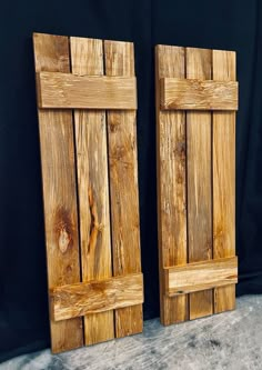 two wooden doors made out of wood planks