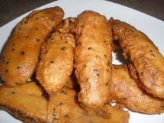 some fried food is on a white plate