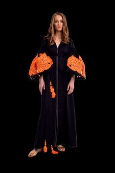 Black/Orange Luxurious Lilies Women's Maxi Caftan. Online store of fashion designer clothes for women. In legends, the lily flower is a symbol of maiden charm, purity, and virtue. Brand Yuliya Magdych, expensive designer dresses. The lily flower also hides the secret of life. Made in UKRAINE with love Kaftan With Woven Motifs For Traditional Ceremonies, Traditional Kimono With Tassels, Traditional Kaftan With Tassels, Folk Style Kaftan With Woven Motifs For Eid, Eid Folk Style Kaftan With Woven Motifs, Folk Style Woven Motifs Kaftan For Eid, Traditional Kaftan With Geometric Embroidery, Festive Kaftan With Geometric Embroidery, Traditional Handmade Kaftan With Kimono Sleeves