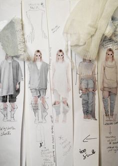 an image of fashion sketches on display in a store