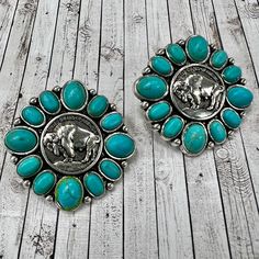 Add a pop of Western-style to your outfit with these Where The Turquoise Buffalo Roams earrings. The silver-plated round earrings feature a classic buffalo coin design and secure post-back closures. Brush up on your style knowing you're wearing a fashionable piece with a story behind it. 1 1/4" in diameter Matching "Where the Turquoise Buffalo Roams" Ring available Coin Design, Your Outfit, Round Earrings, Western Style, Western Fashion, Happy Valentine, Antique Jewelry, Buffalo, Silver Plated