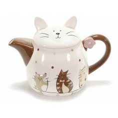 a ceramic teapot with cats painted on it