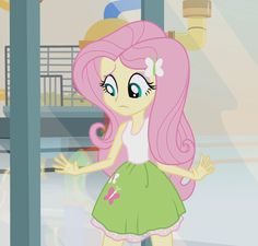 a pinkie is standing in front of a window with her hands out to the side