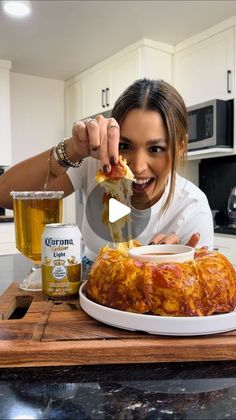 a woman is cutting into a cake with a knife