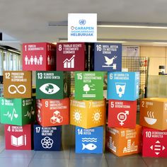 colorful cubes with different symbols on them in an office building or conference room area