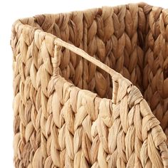 a large woven basket with handles on the bottom is shown in natural colors and texture