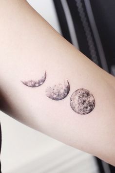 three phases of the moon tattoo on the arm