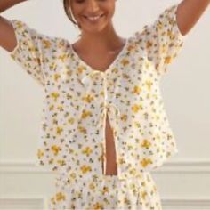 Nwt, 100% Cotton, Size Xxs, This Is A Set It Includes Top And Shorts, Shorts Have A Ruffle Detail In The Bottom And A Stretchy Waist Band, Top Its A Pullover Style, Has Some Bow Details In The Front, Main Color Its White, Yellow Qnd Black Floral Print. Measurements Laying Flat Shorts : Waist 13” Top To Bottom 13” Top: Pit To Pit 18” Shoulder To Bottom Front 19 1/2” Shoulder To Bottom Back 20 1/4” Questions And Offers Are Welcome Please Look At The Pictures/ Videos Thank You Yellow V-neck Top For Loungewear, Yellow Sleep Top For Spring, Yellow Summer Tops For Loungewear, Yellow Cotton Spring Sleepwear, Yellow Cotton Sleepwear For Spring, Yellow Casual Sleep Top, Casual Yellow Sleep Top, Casual Summer Sleep Tops, Floral Print Short Sleeve Sleep Top