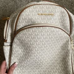 New Beige And Brown Beige Michael Kors Backpack With Adjustable Strap, Michael Kors Beige Backpack With Adjustable Strap, Designer Beige Backpack For Travel, Michael Kors Beige Backpack, Designer Beige Backpack For Everyday Use, Beige Backpack With Adjustable Strap For Errands, Luxury Beige Backpack For Errands, Michael Kors White Travel Backpack, Michael Kors White Standard Backpack