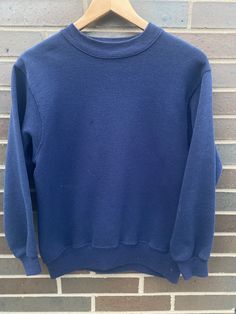 Vintage 1990s Hanes Crewneck Pullover Sweatshirt - Size S (Length 22.5" Chest 18") - Overall great vintage condition - No holes/one small stain pictured  - Message for more information Please take note of the measurements listed as these are vintage clothes and may fit different than the tag size. Follow our page for more vintage clothing drops! Connect with us on Instagram: @recurarchives Navy Sportswear Sweatshirt For Fall, Navy Athleisure Sweatshirt With Ribbed Cuffs, Navy Sporty Sweatshirt For Fall, Navy Athleisure Sweatshirt For Winter, Sporty Navy Sweatshirt For Fall, Athleisure Crew Neck Sweater In Solid Color, Blue Sportswear Sweats For Fall, Solid Color Crew Neck Sweater For Athleisure, Navy Fleece Crew Neck Top