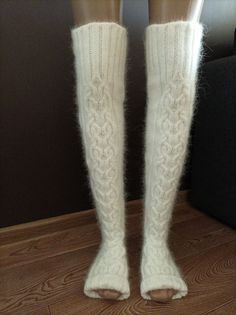 High socks are knitted from angora with the addition of nylon (for durability). Angora yarn is made from angora rabbit down, so the socks are very soft and delicate. These long socks are warm, cozy and fluffy. Look how These socks can be called stockings) You can wear them when doing household chores or when watching TV on the couch. You will look very impressive! Dress them in bed and you will be warm, soft and cozy. I knit with premium quality yarn. The fingerless socks are suitable for yoga d Fitted Warm White Knee-high Socks, White Warm Knee-high Socks, Warm White Knee-high Socks, Cozy White Leg Warmers For Stocking Stuffers, White Knee-high Comfortable Leg Warmers, Comfortable White Knee-high Leg Warmers, Comfortable Warm White Knee-high Socks, Winter White Knee-high Stockings, Cozy Warm White Knee-high Socks