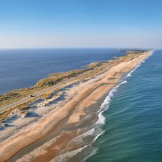 an aerial view of the beach and ocean