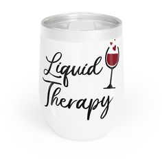 a wine glass with the words liquid therapy on it