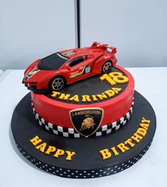 a birthday cake with a racing car on top