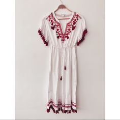 The Perfect Summer Dress!! Summer Wouldn't Be Summer Without A Breezy, Gauzy Dress. This One Features Embroidery In Pretty Shades Of Red With Tasseled Details. Lined. Like New Without Tags. $260 New. Cotton/Modal - Relaxed Fit - Apx 45” In Length, Based On A Size S. Armpit To Armpit: 18”, Waist At Largest Uncinched 18” Also. Split Neck With Tasseled Self-Tie Closure; Elastic Waist; Side Seam Pockets; Tassel Fringe. Embroidered Summer Holiday Dresses, Red Embroidered Summer Maxi Dress, White Floral Embroidery Summer Maxi Dress, White Maxi Length Holiday Dress, Red Embroidered Maxi Dress For Summer, Holiday Red Embroidered Dress, White Cotton Summer Boho Dress, White Embroidered Boho Dress For Beach, White Bohemian Midi Dress For Festival